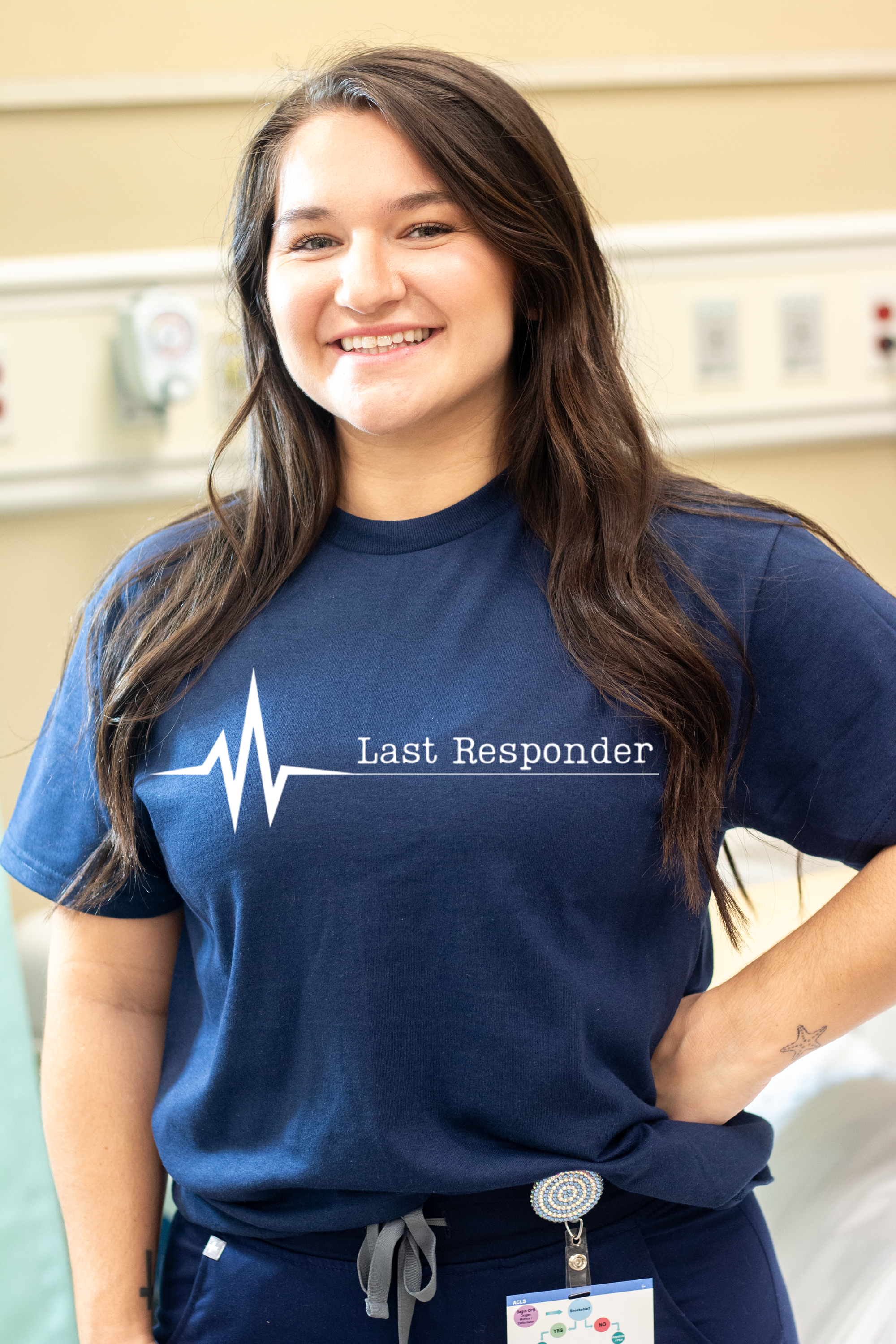 Our Last Responder T-Shirt for Hopsice Nurses is a great t-shirt with a logo on the front. It's simple design makes a powerful statement. It is a dry blend t-shirt with short sleeves. It is available in black, white and blue.